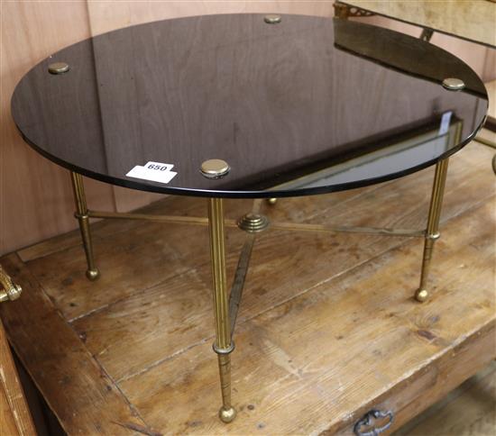 A black glass topped brass occasional table, W.70cm